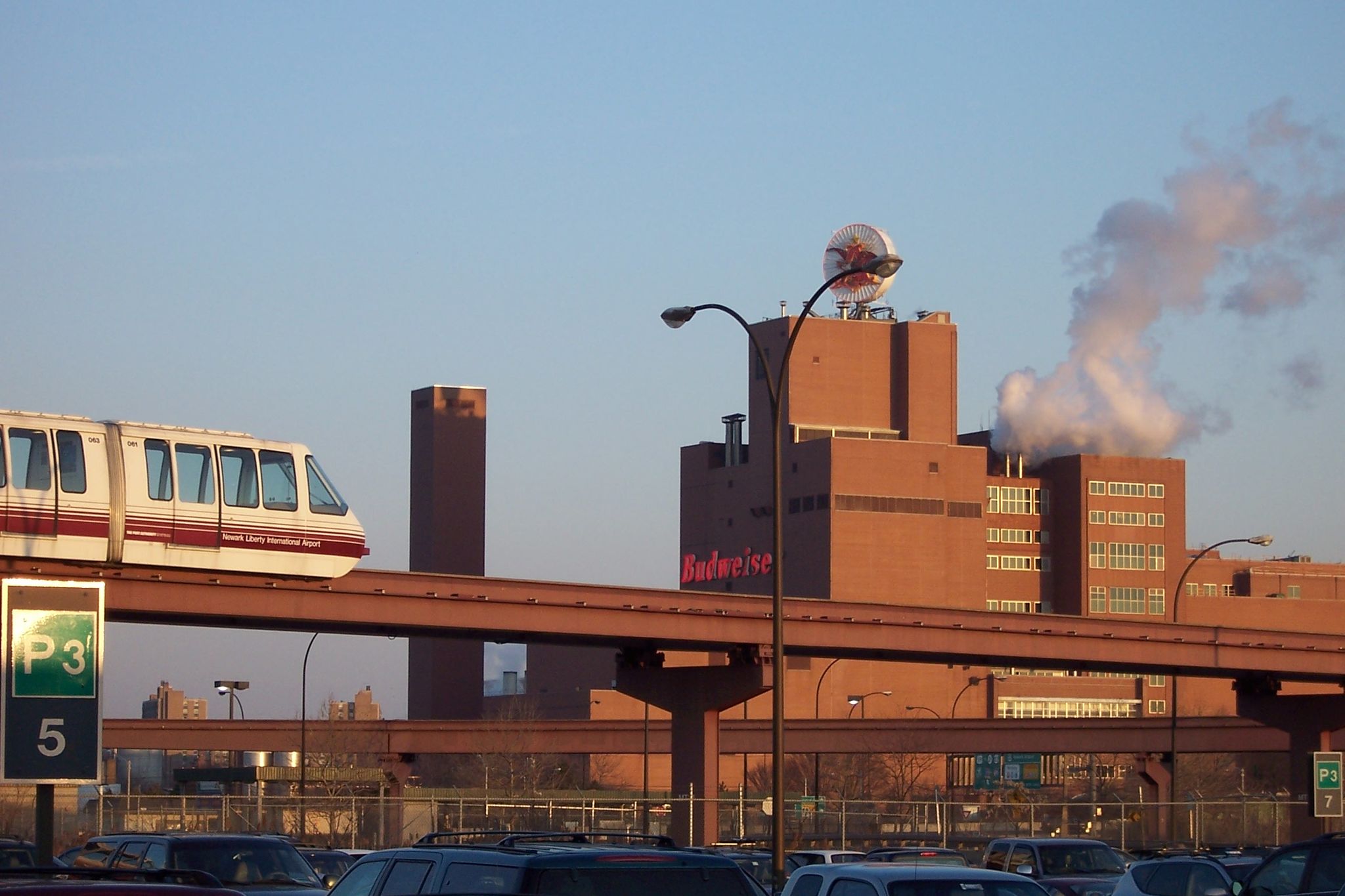 AirTrain Newark grinding over a parking lot