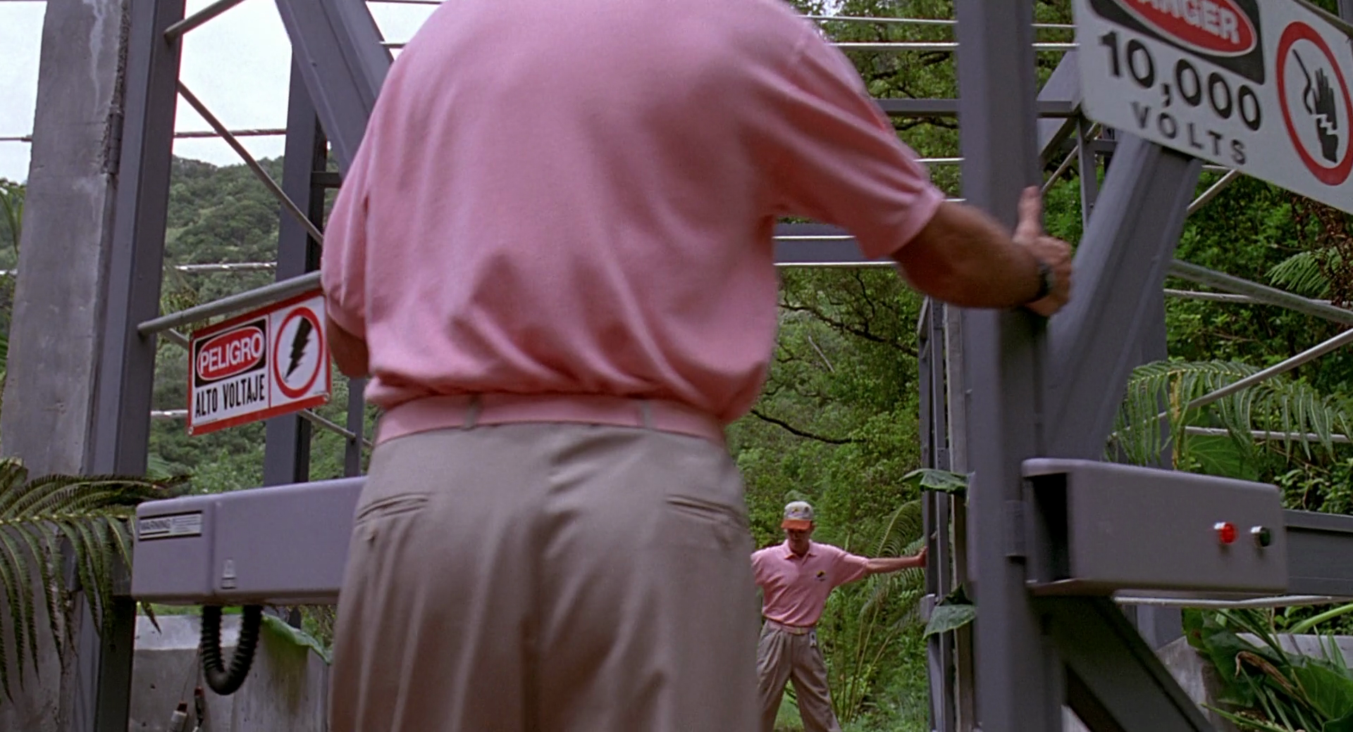 Spielberg shows a number of these pink-shirted workers in the opening scenes. They all leave on the boat and are never seen again. In the book, they're also never seen again and they didn't leave on the boat.