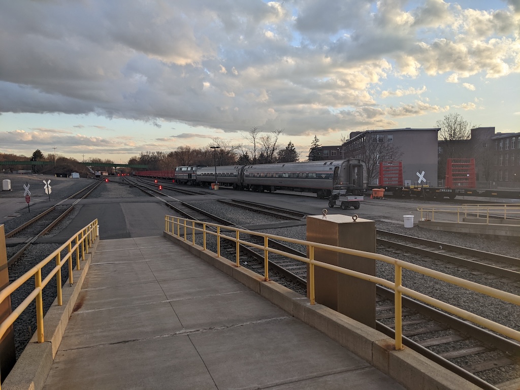 Amtrak #704 with two Amfleet coaches backs up to the Maple Leaf