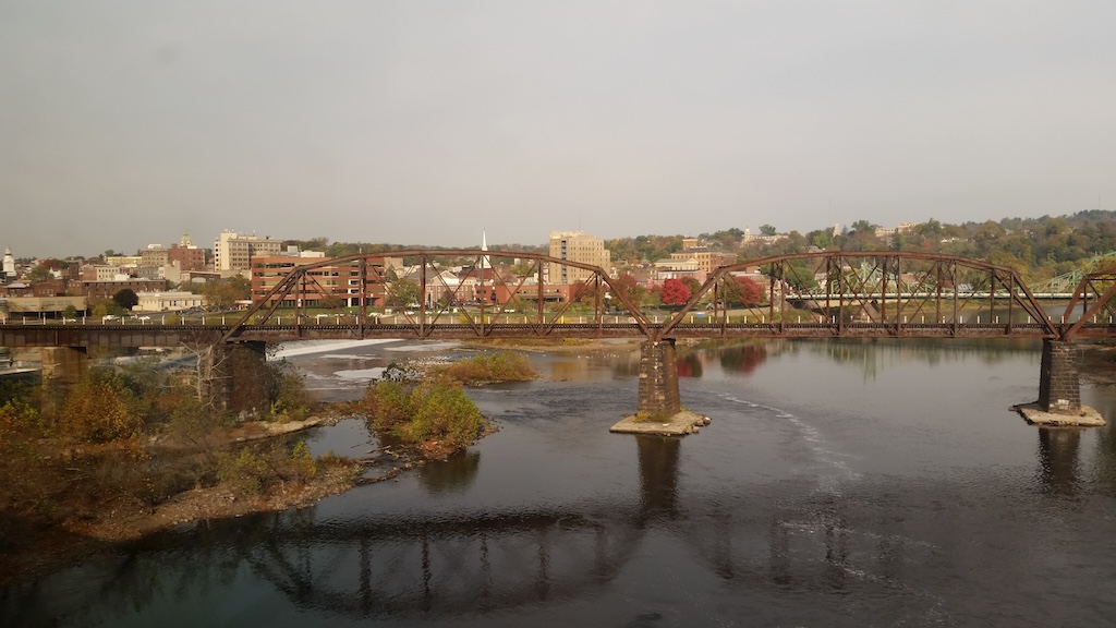 Crossing the Delaware on the Autumn Express in 2016. In the foreground is the former Lehigh and Hudson River Railway bridge. In the background is Easton, Pennsylvania