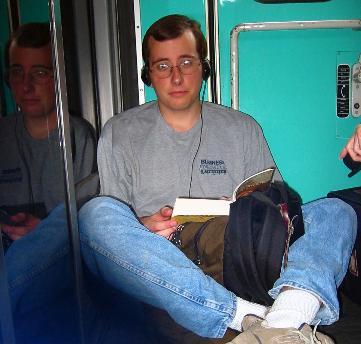 Sitting in the gangway of a train in France reading Buddenbrooks. May 2003.
